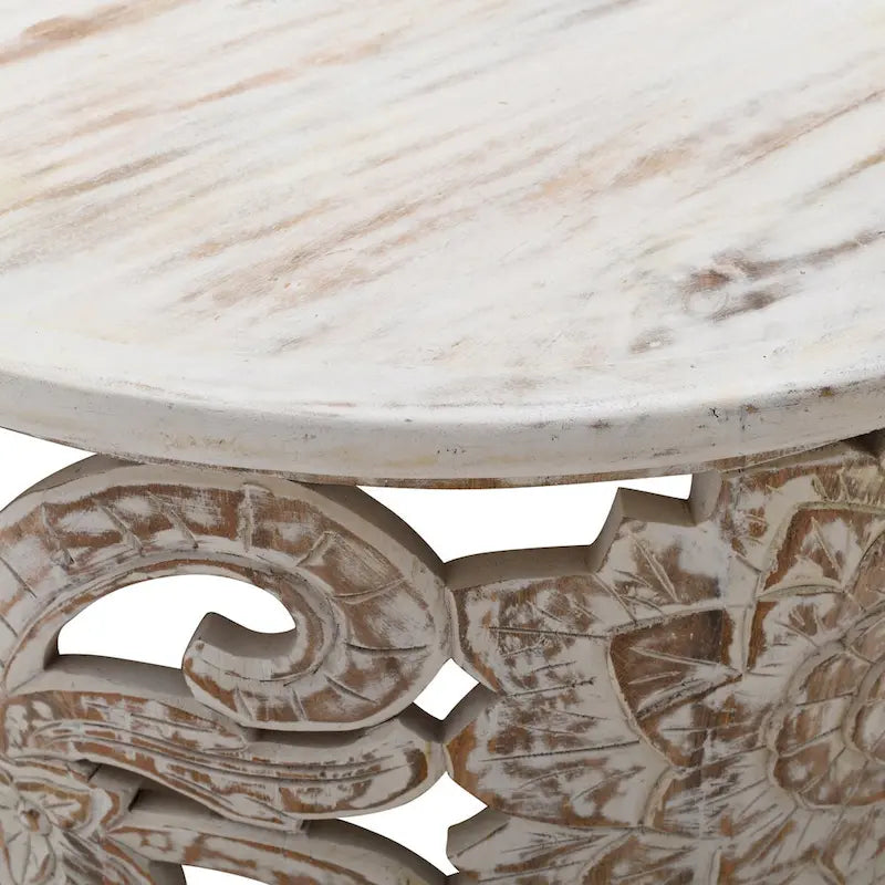 Table basse ronde en bois de manguier avec motifs floraux sculptés