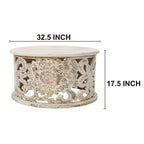 Table basse ronde en bois de manguier avec motifs floraux sculptés