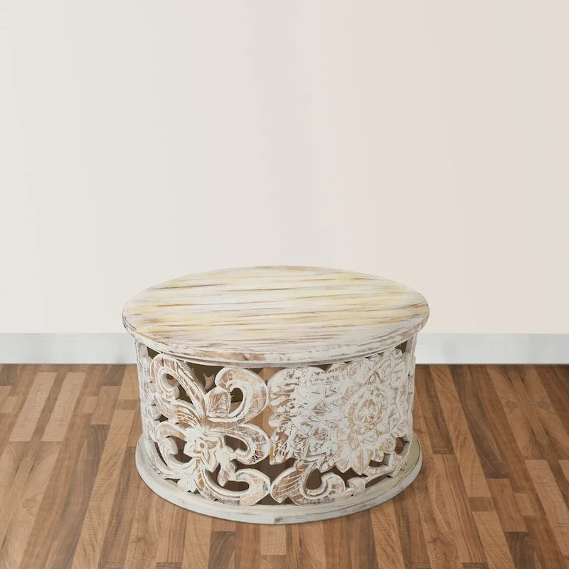 Table basse ronde en bois de manguier avec motifs floraux sculptés